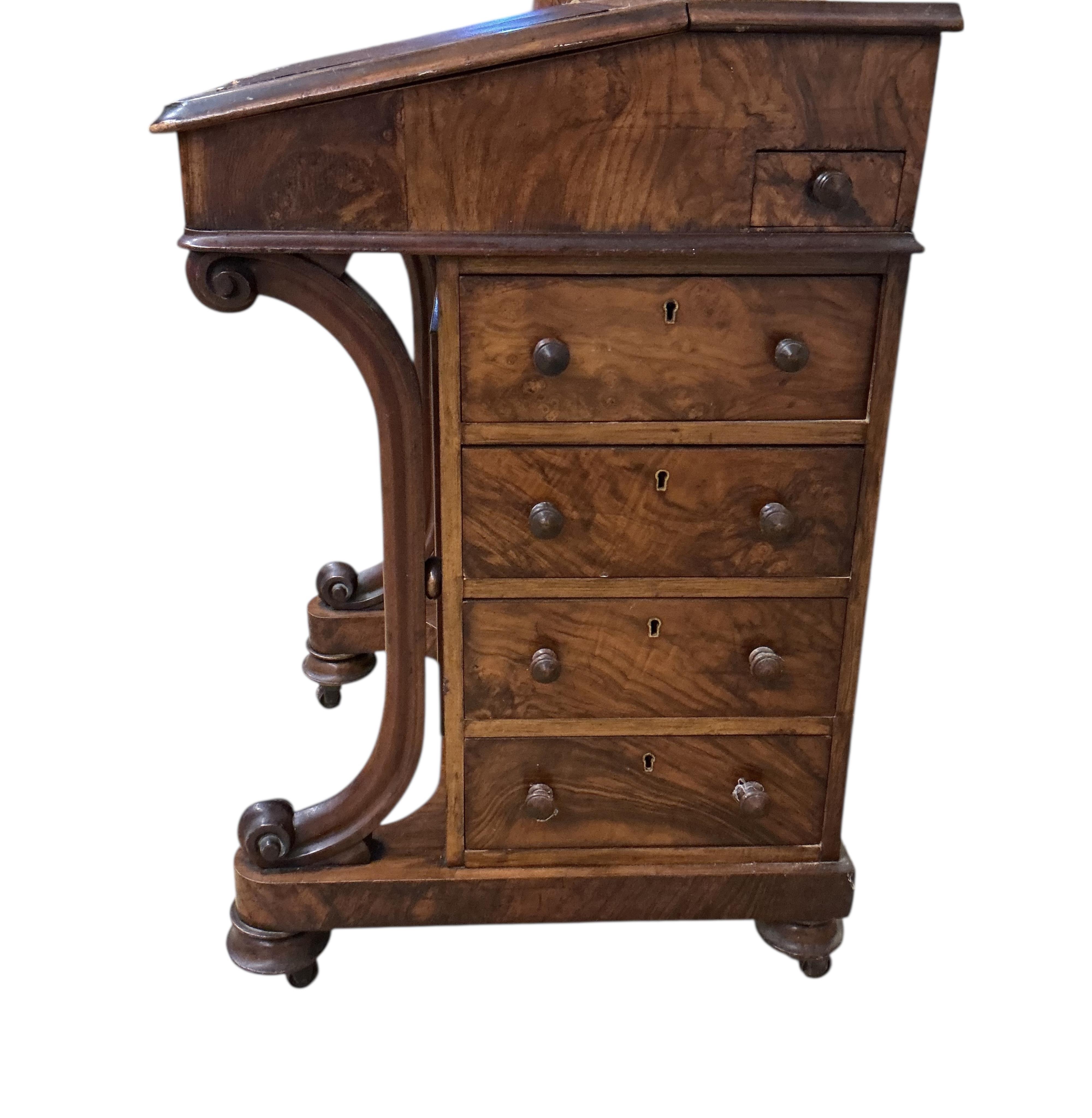A Victorian figured walnut Davenport, lacks superstructure, width 53cm, depth 53cm, height 81cm
